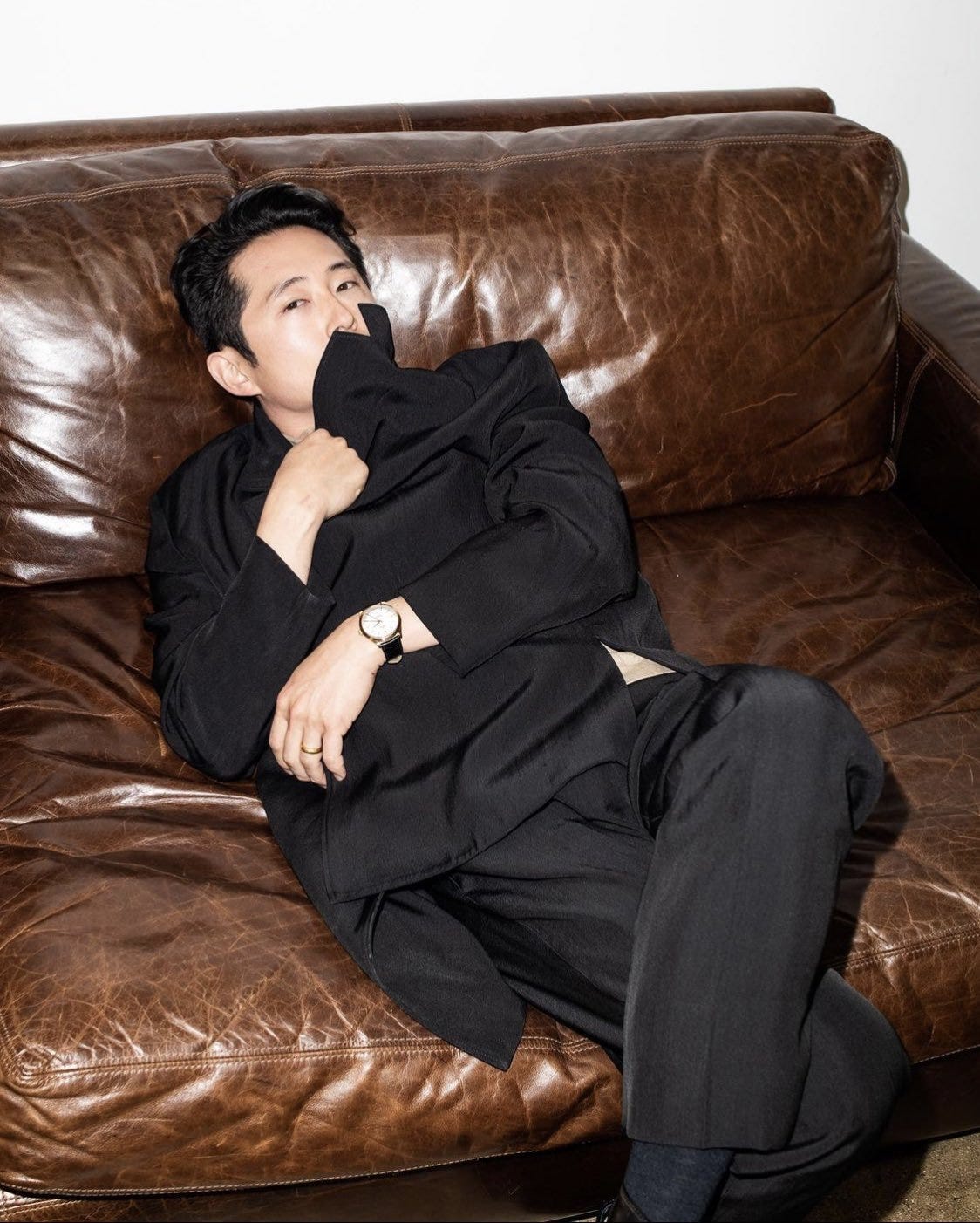 steven yeun legs crossed