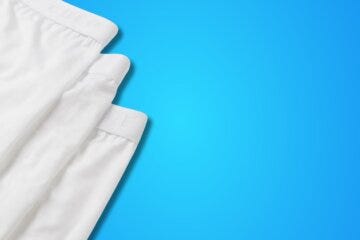 flat lay image of 3 white pairs of men's underwear