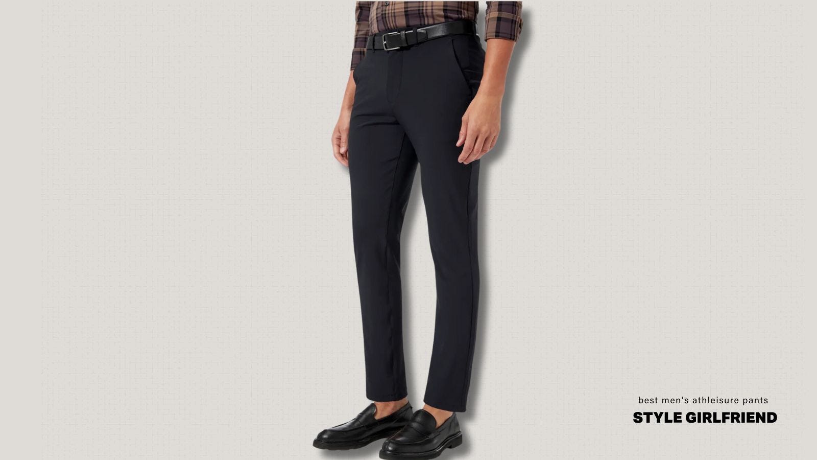 best dressy athleisure pants for work - image of the lower half of a man wearing black chinos with loafers