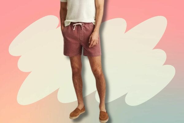 image of lower torso and legs of a man wearing a cream-colored short sleeve shirt with red corduroy drawstring shorts and brown suede espadrilles