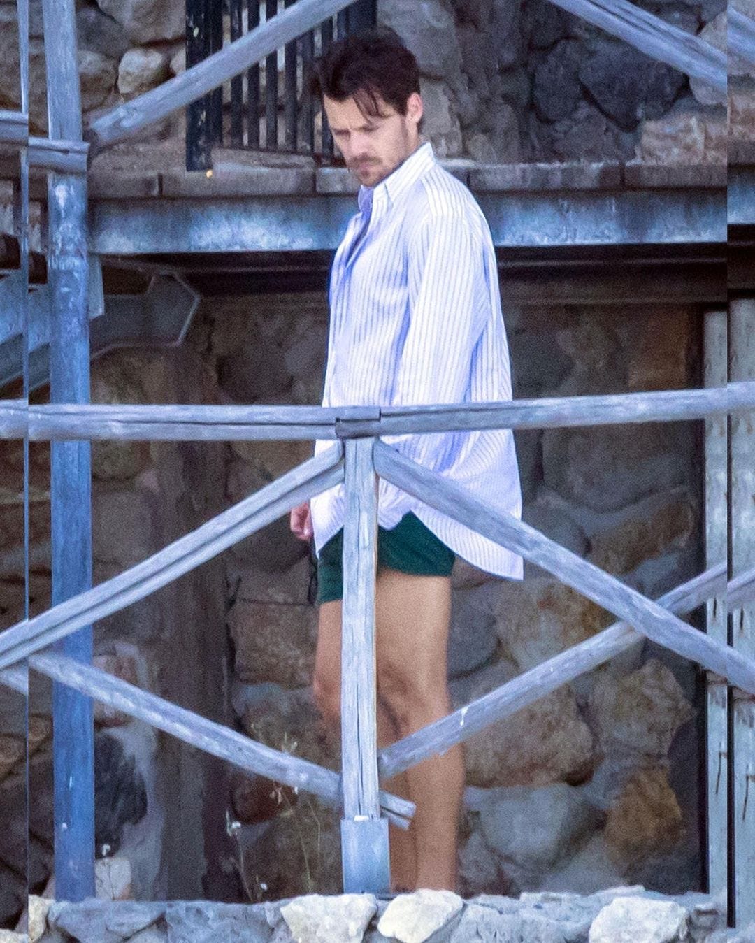 Harry Styles in Italy wearing green shorts, casual short summer outfit men