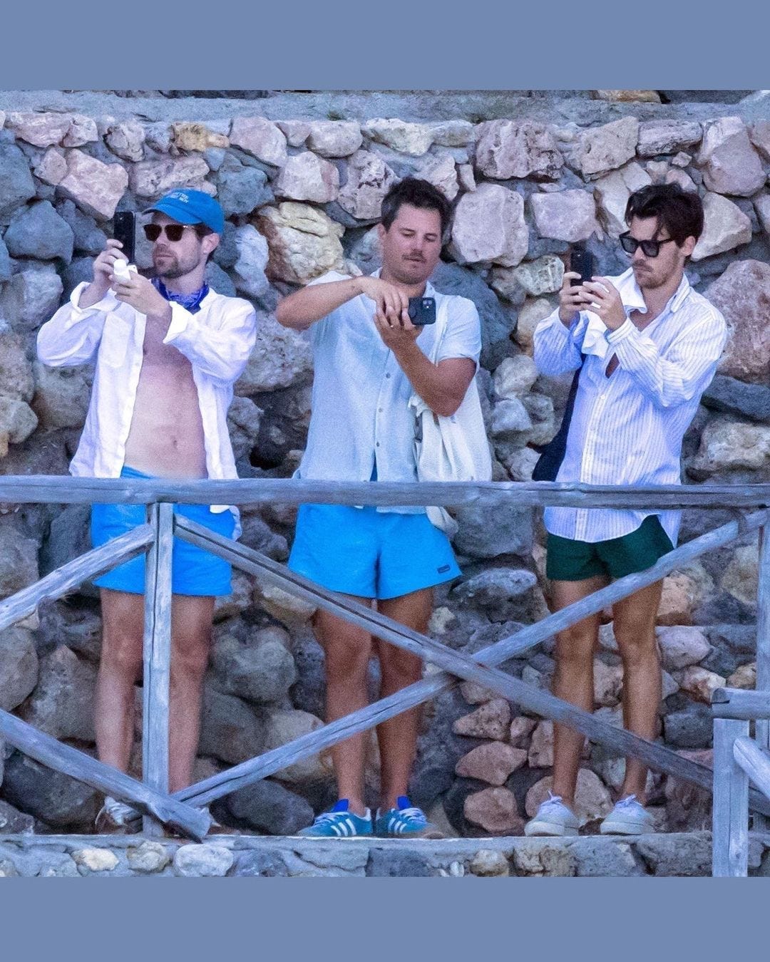Harry Styles and friends in Italy taking pictures, casual short summer outfit men