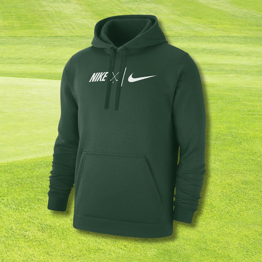 forest green hoodie set against a background of a golf course