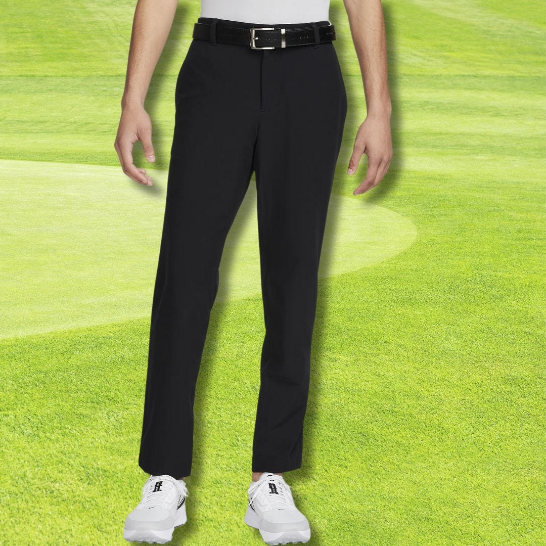 lower half of man wearing black golf pants with black belt and white golf shoes