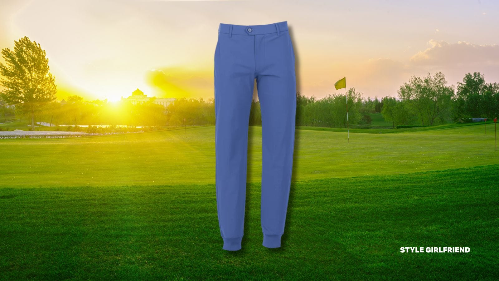 pair of blue performance joggers set against a golf green background