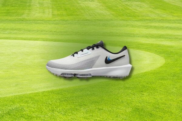 men's nike golf shoe set against a background of a golf green