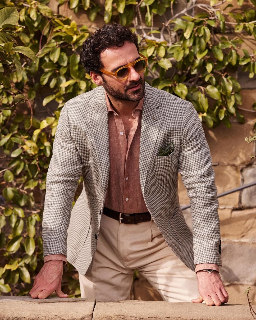 Italian summer men's clothing inspiration, man wearing light blazer, linen shirt and tan pants