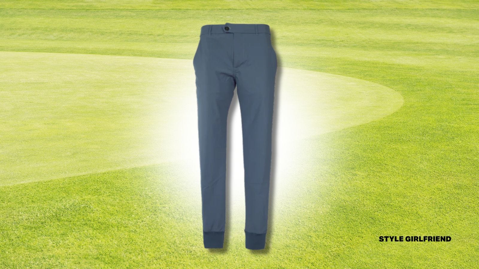 pair of blue greyson montauk joggers set against an image of a golf green