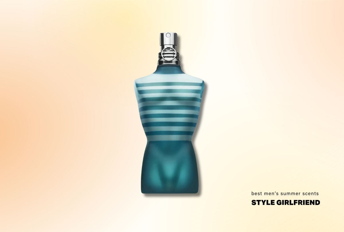bottle of fragrance shaped like a man's torso with blue-green liquid and a silver cap