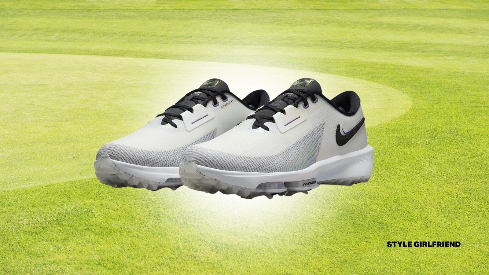 pair of men's spike golf shoes, set against a golf green background