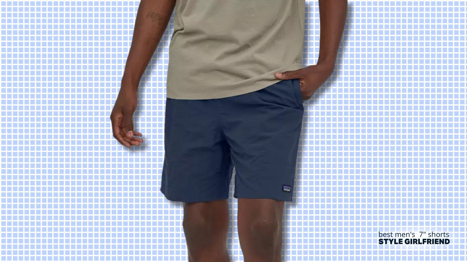 torso of man wearing a grey t-shirt and navy performance shorts