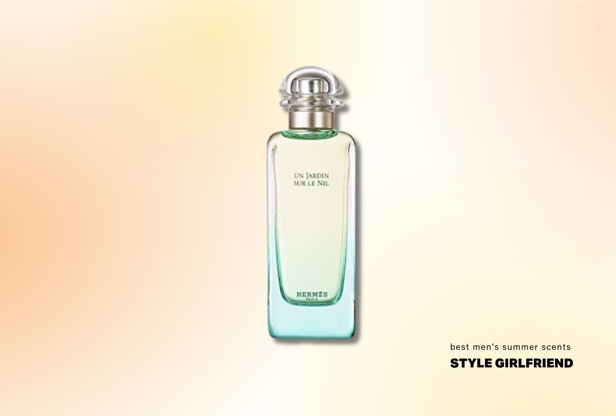 tall rectangular bottle of fragrance with a blue-green tint, and gold accents at the neck