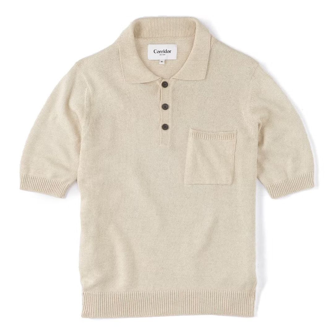 off-white knit polo against a white background, included in a roundup of light colored outfits for men