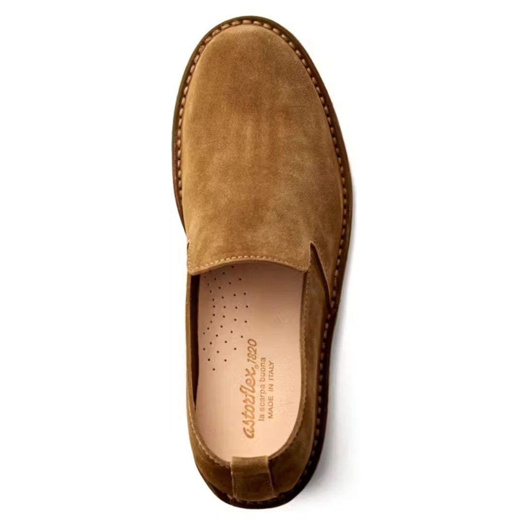 single leather loafer against a white background