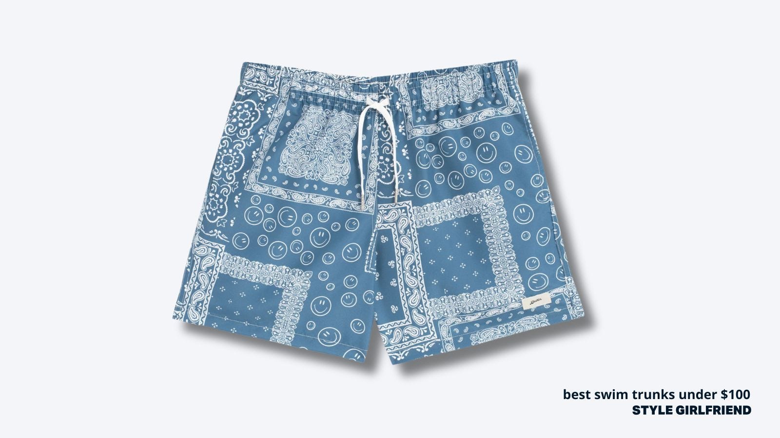 image of men's swim trunks in a light blue bandana pattern. text on-screen reads: best swim trunks under $100, style girlfriend