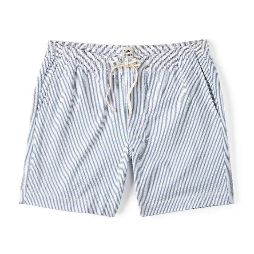 pair of blue and white seersucker shorts against a white background