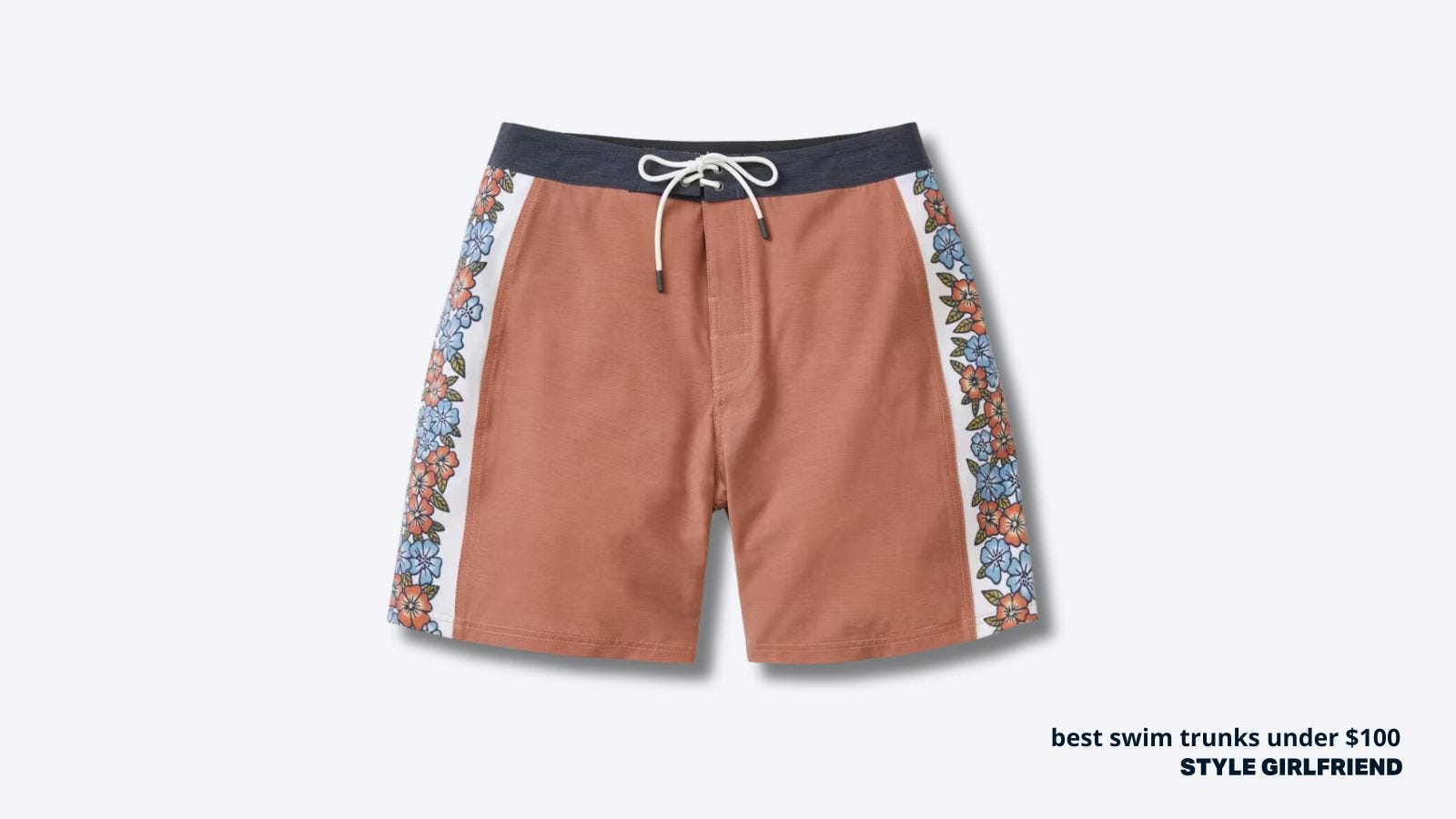 flat lay image of salmon-colored board shorts with a pattern down each leg. text on-screen reads: best swim trunks under $100
