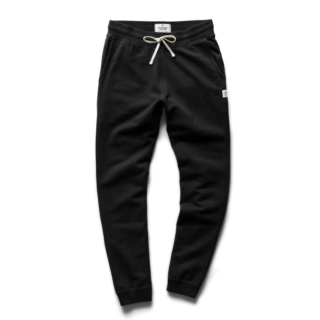 pair of black sweatpants arranged against a white background