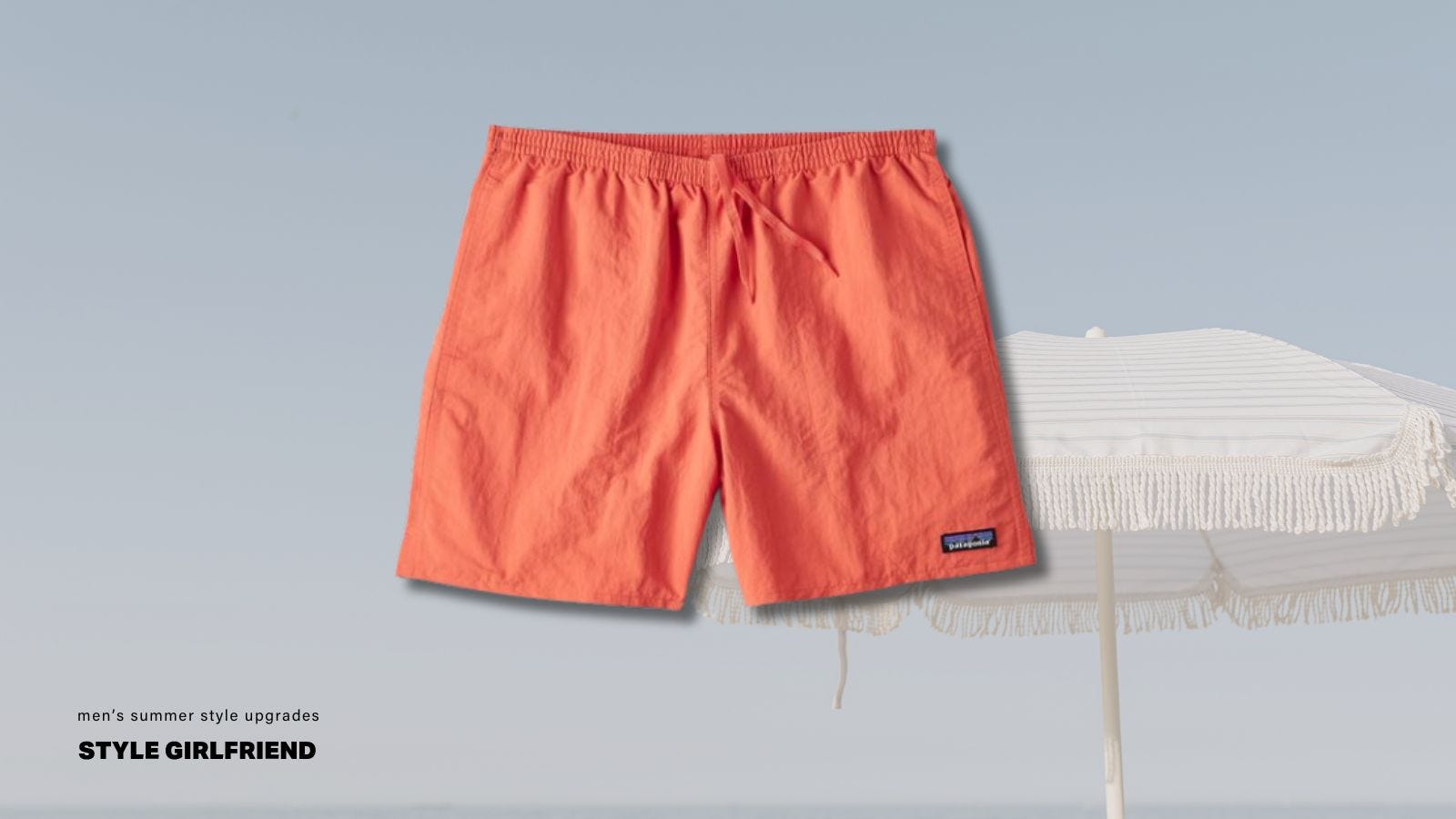 A pair of peach colored Patagonia suspender shorts on a beach background image