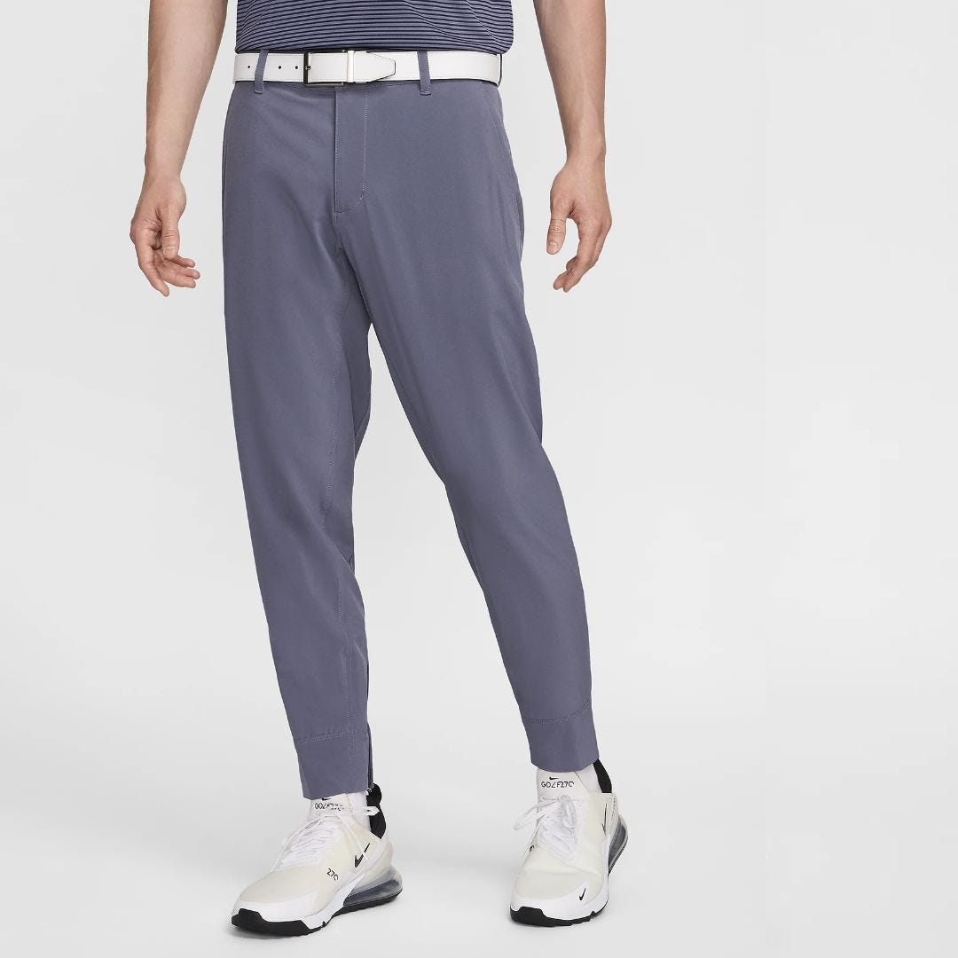 image of a man from the waist down wearing light blue golf pants with a gathered ankle, white belt, and white golf shoes