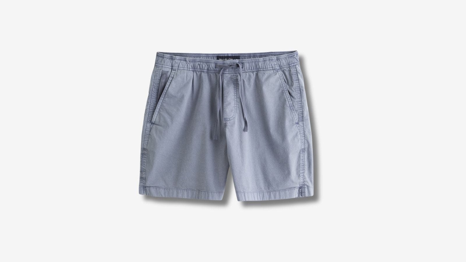 pair of blue drawstring shorts against a blank background
