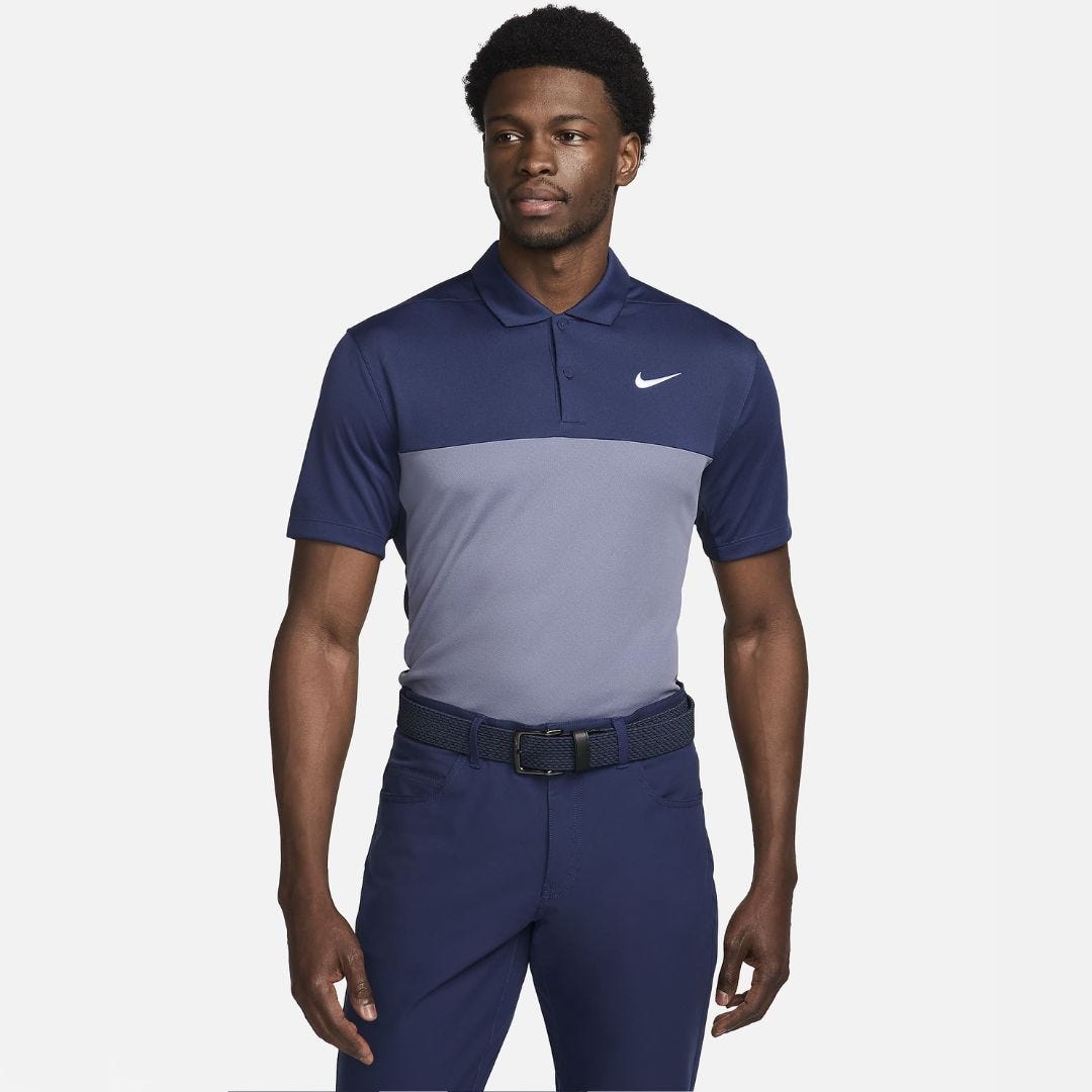 man from the knees up wearing a polo shirt with the nike swoosh embroidered on the chest