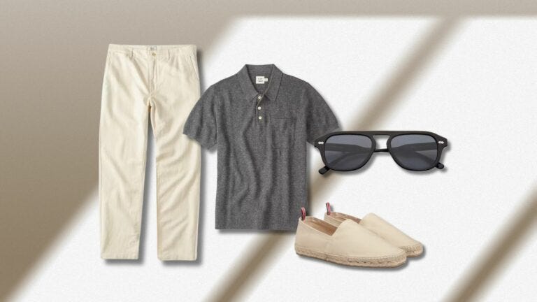 flat lay of a casually stylish men's weekend outfit featuring light-colored khaki pants, a grey knit polo, black frame sunglasses, and light-colored espadrilles