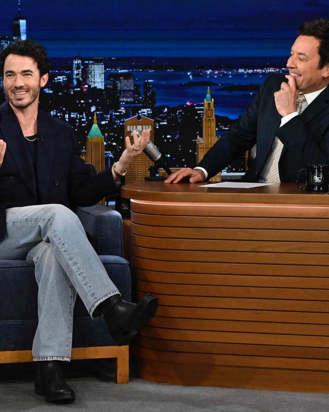 Kevin Jonas and Jimmy Fallon on the set of the Tonight Show