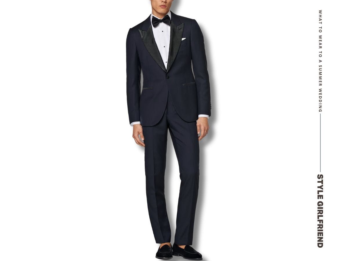 man from the neck down in a navy tuxedo and tuxedo slippers. text on-screen reads: what to wear to a summer wedding