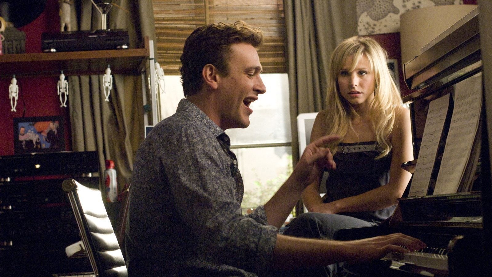 forgetting sarah marshall movie still with jason segel and kristen bell sitting at a piano