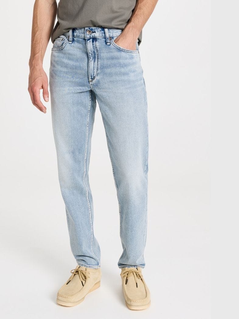 man from the waist down wearing light wash a.p.c. jeans