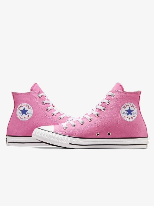 pair of pink converse high top sneakers facing one another