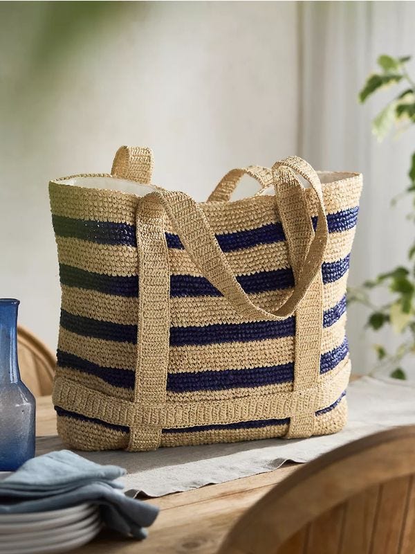 striped raffia tote sitting on a dining room table