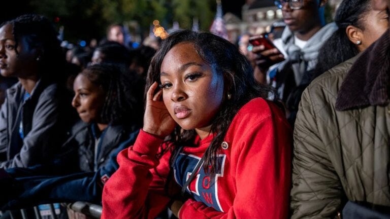 disappointed woman wearing red sweatshirt looking at camera