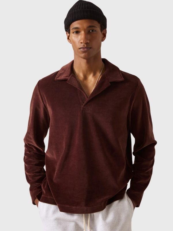 stylish man wearing a long-sleeve polo shirt and beanie