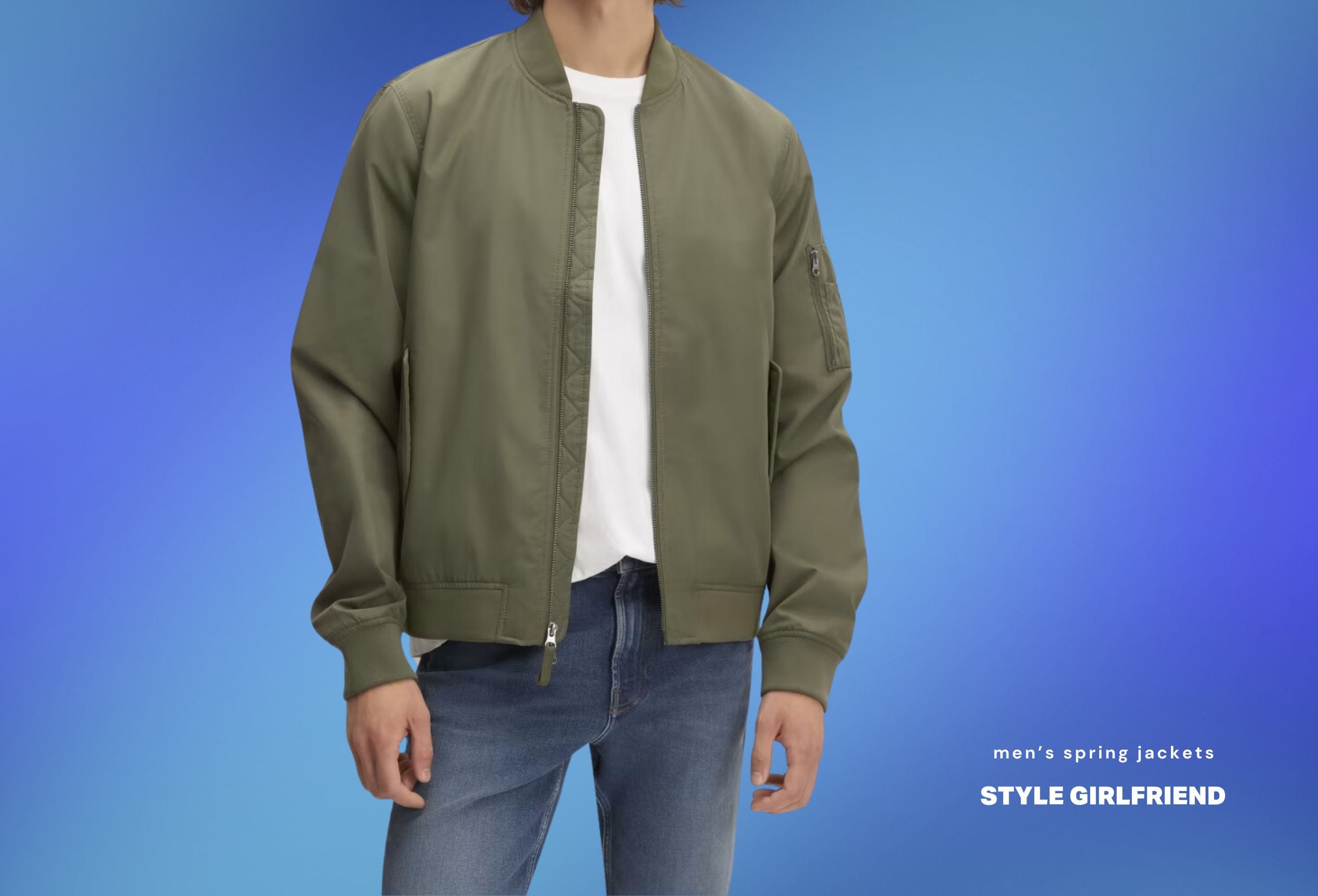 stylish man wearing a green bomber jacket over a white t-shirt with jeans