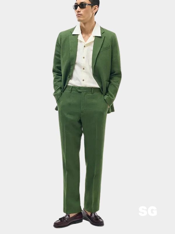 man wearing a green linen suit