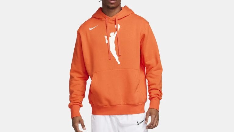 close-up of a man wearing an orange WNBA hoodie sweatshirt