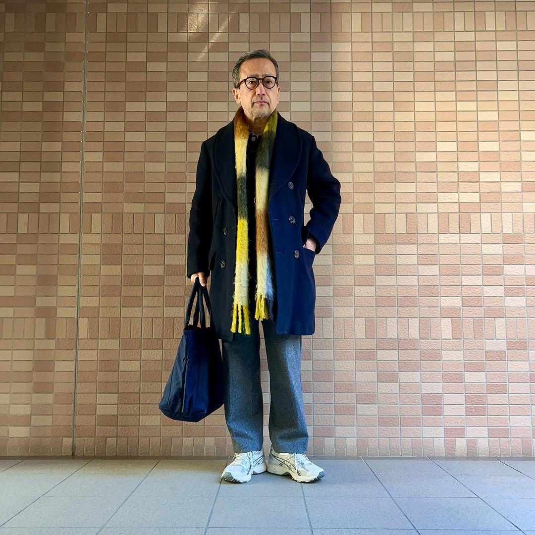 stylish man wearing a business casual outfit with asics sneakers