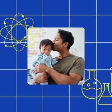father kissing his baby son