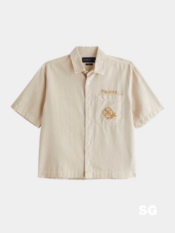 cropped short sleeve button down shirt with "pacifico" over breast pocket