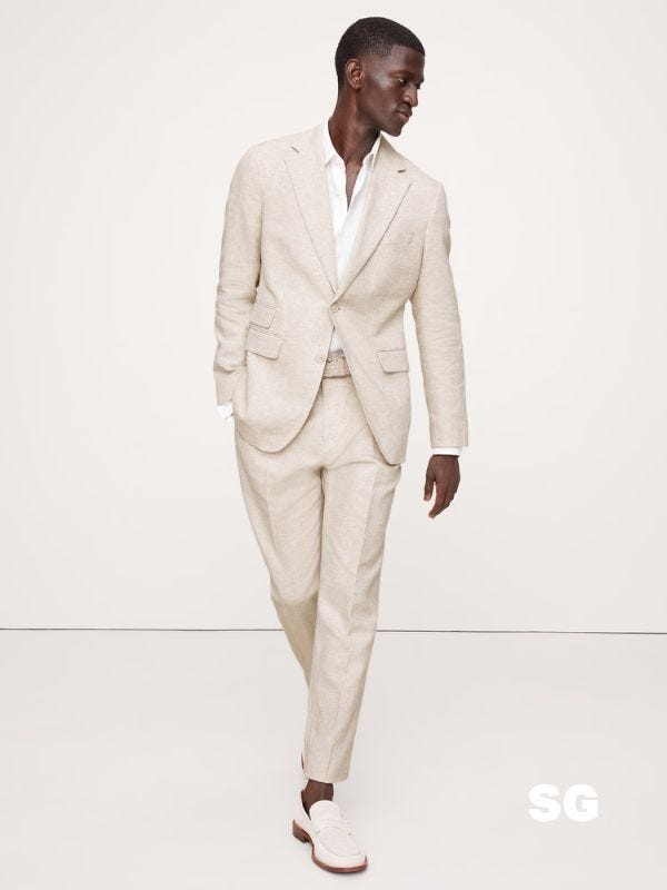 stylish man wearing a lightweight suit perfect for. asummer wedding