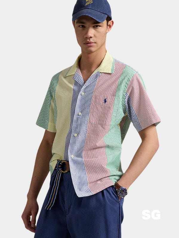 stylish man wearing a multi-color seersucker short sleeve shirt