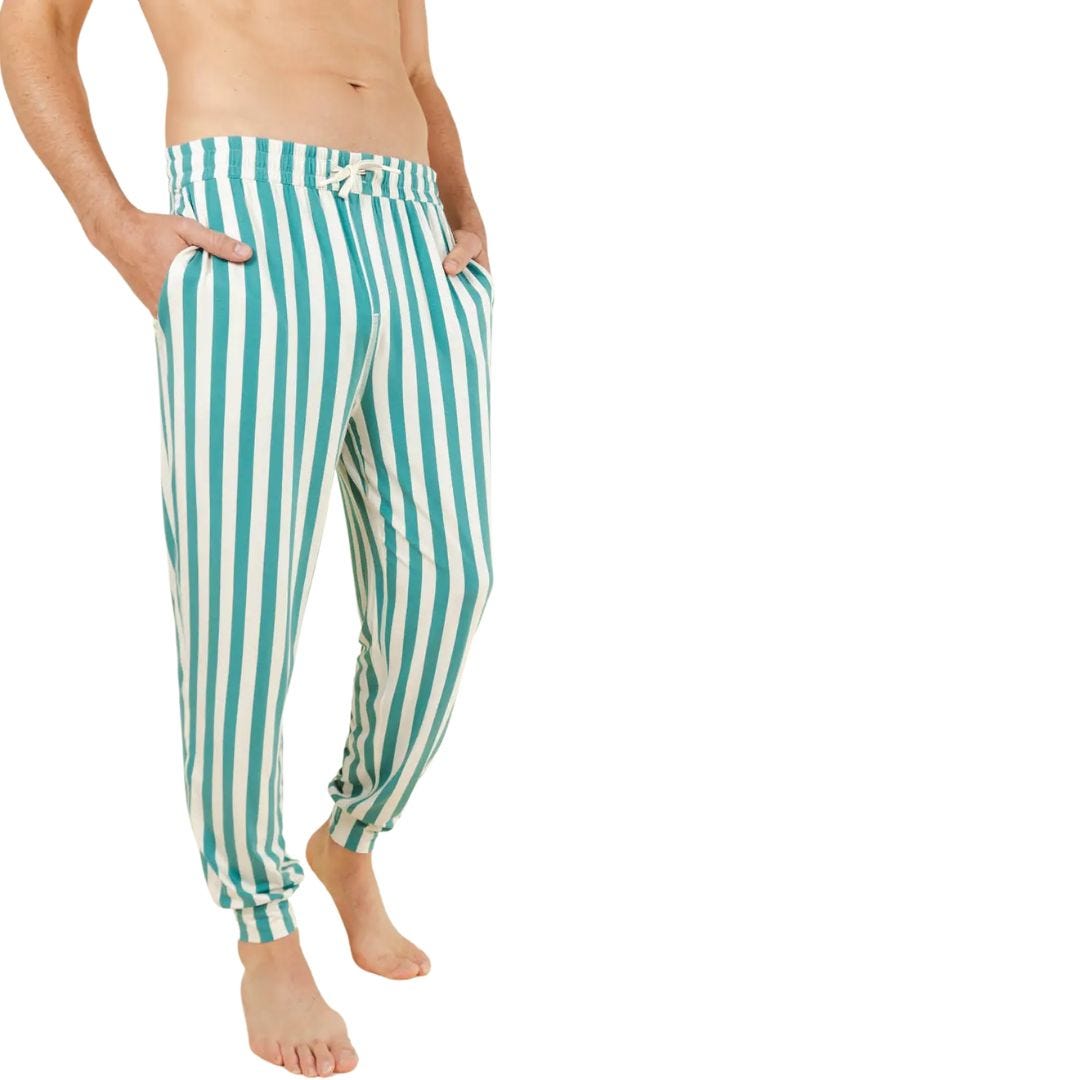 man from the waist down wearing striped white and green pajama pants