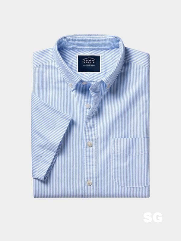 folded short-sleeve blue and white oxford shirt