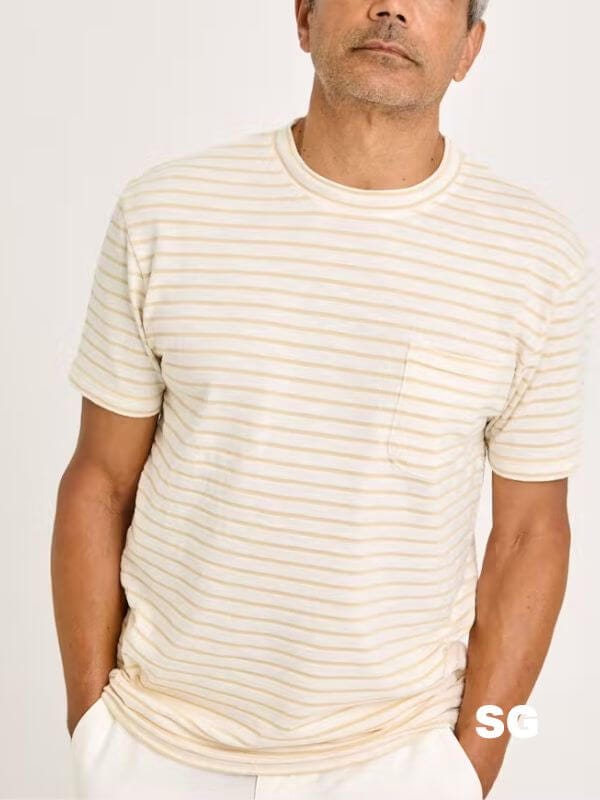 close-up of a man wearing a yellow striped t-shirt