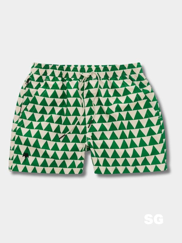 green and white patterned swim trunks