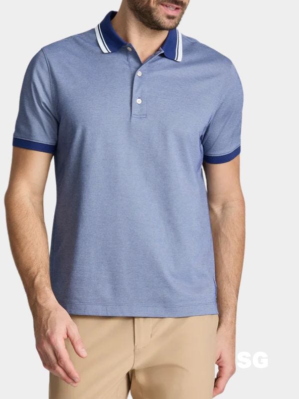 close-up of a man wearing a light blue polo shirt with tan pants