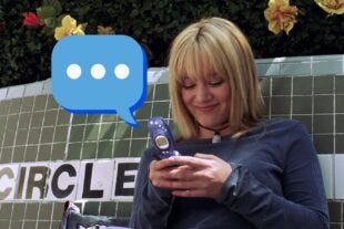 actress hilary duff texting on a flip phone in a still from the movie "A Cinderella Story"